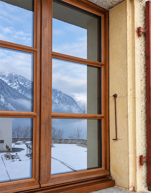 Restored heritage wooden window facing the mountains